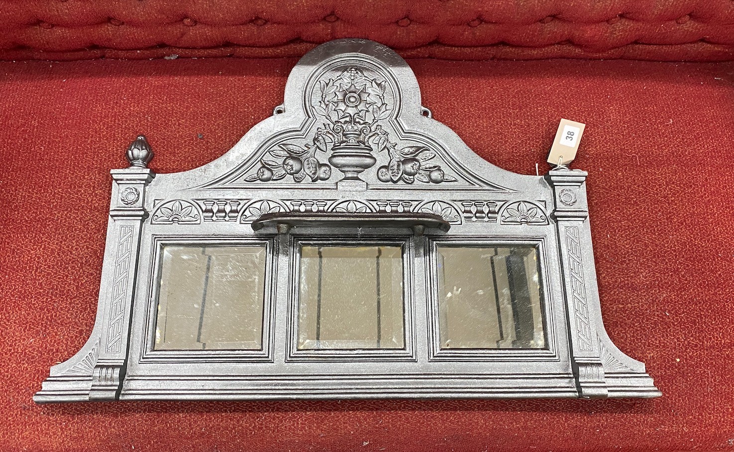 A small Victorian cast iron overmantel mirror, width 82cm, height 54cm